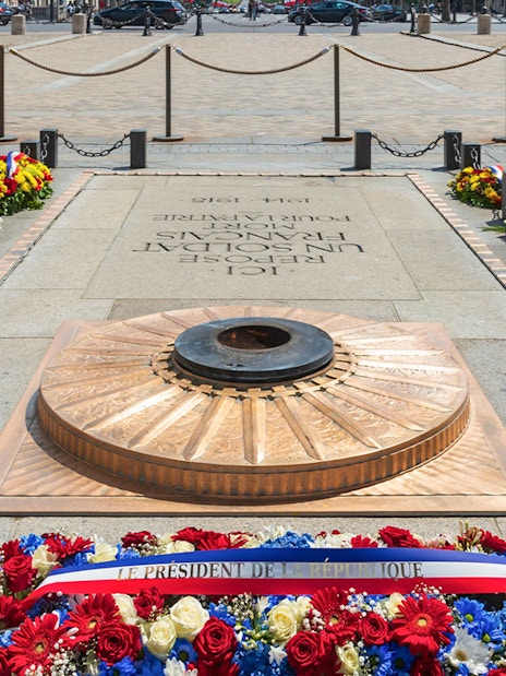 Tomb of the Soldier with eternal flame and wreaths at the Arc de Triomphe, Paris.