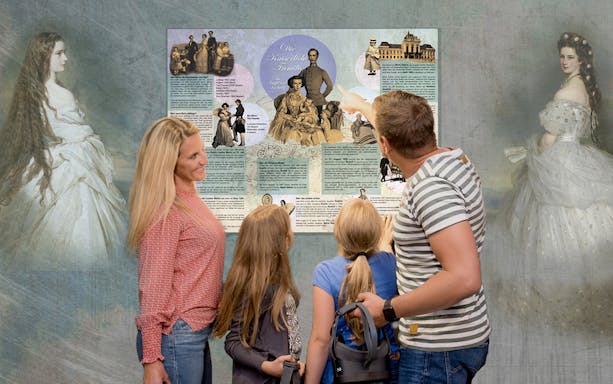 Guests viewing historical exhibits at Time Travel Empress Sisi Virtual Reality Experience.