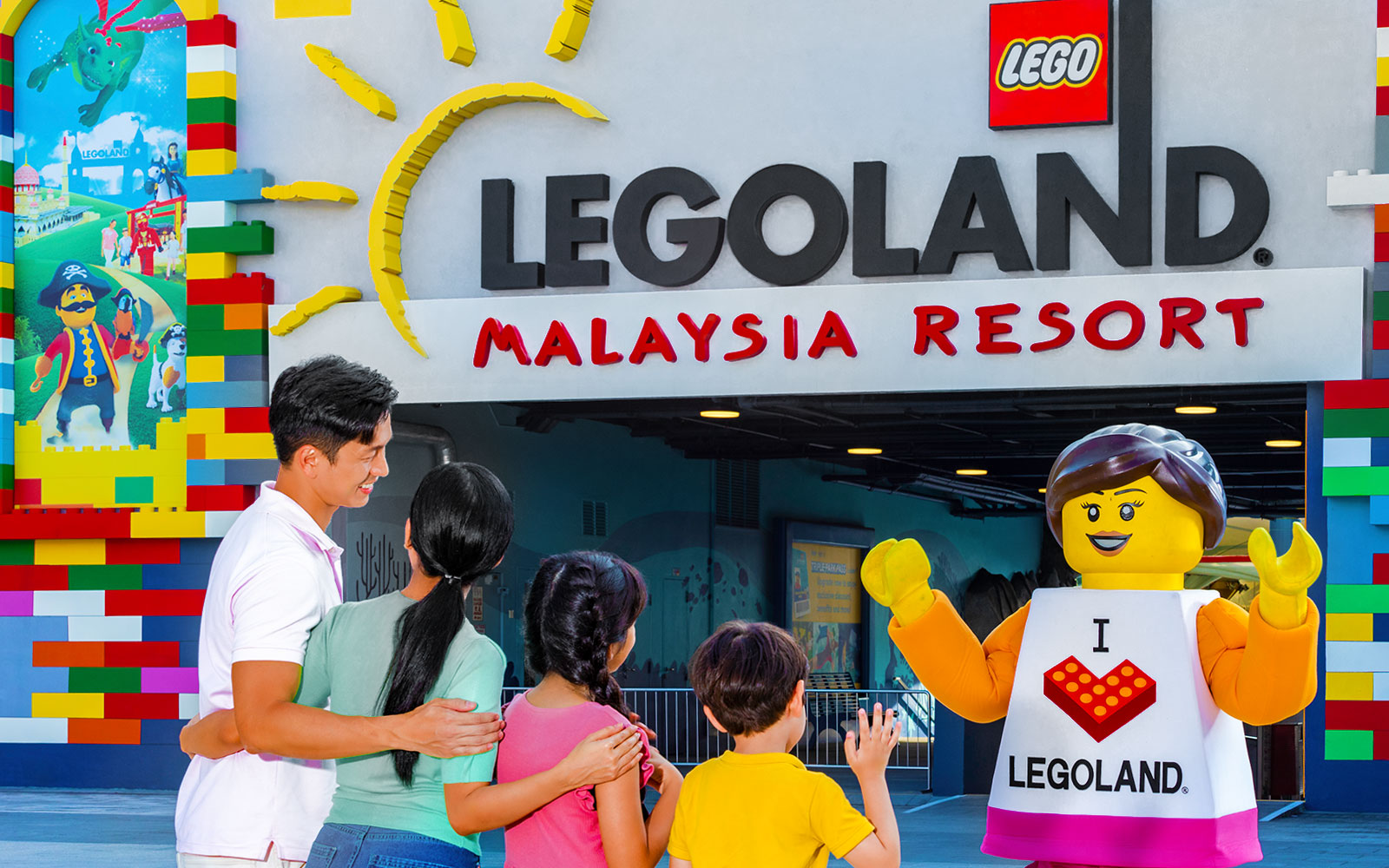 Family meeting LEGO character at Legoland Malaysia Resort entrance
