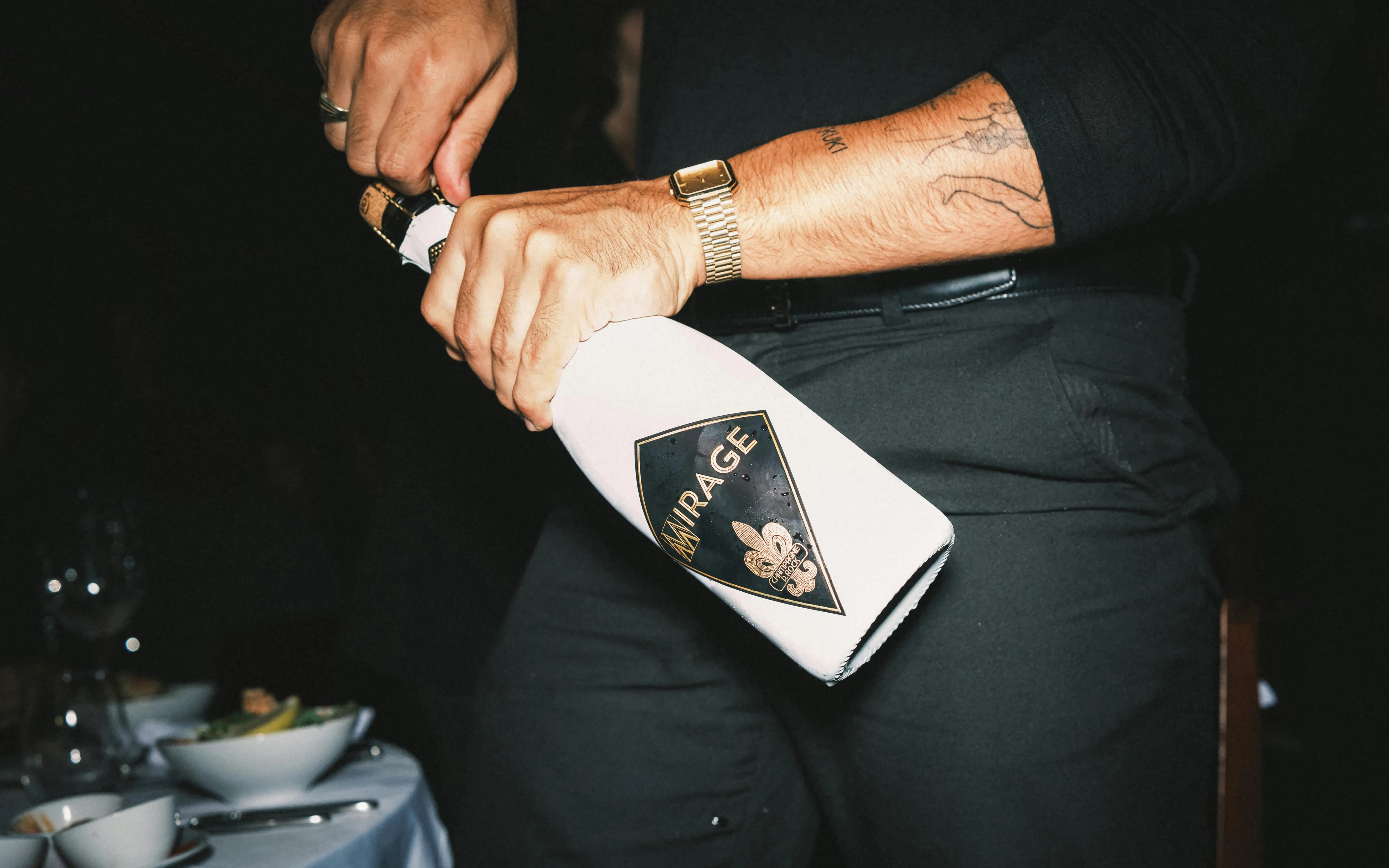 Opening champagne bottle at Burlesque Dinner Club, Vienna.