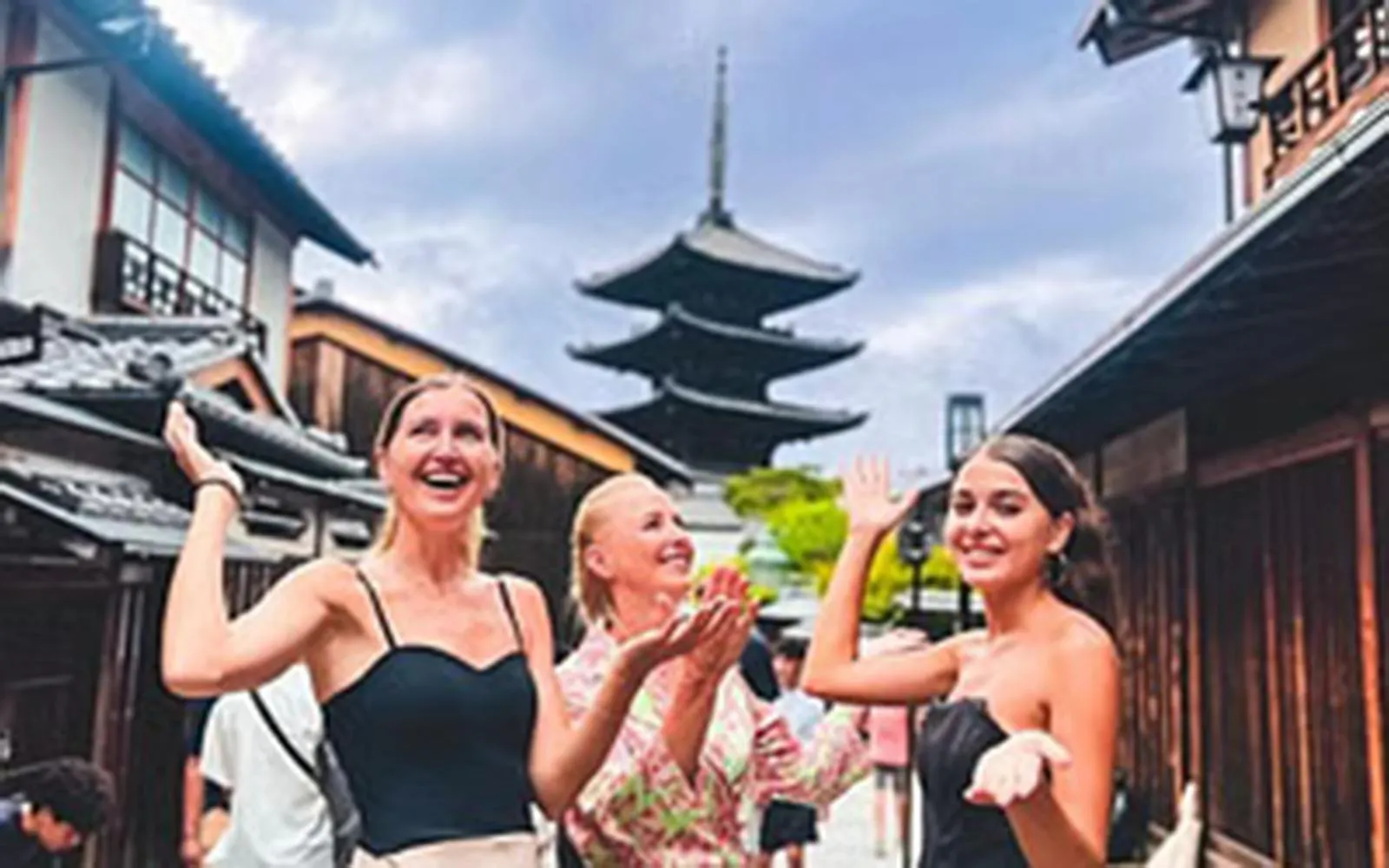 Visitors enjoying the Gion district with Yasaka Pagoda in Kyoto, Japan.
