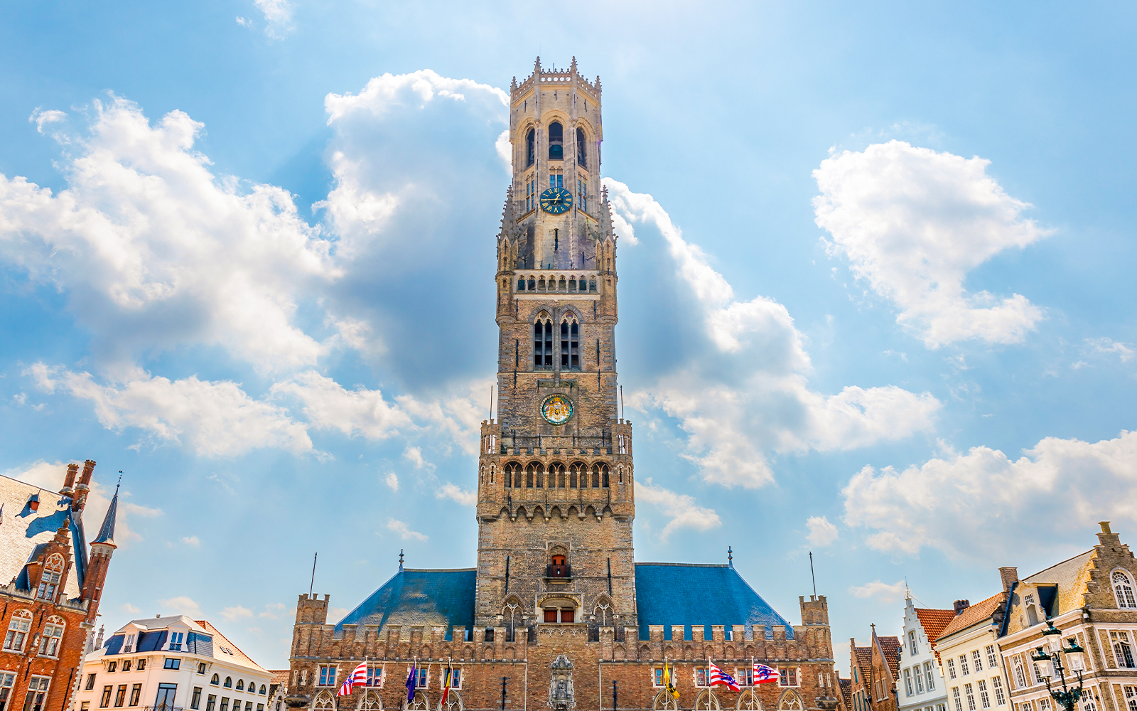 Historium Brugge facade with medieval architecture and tourists exploring the entrance.