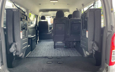 Interior of a spacious van for private transfer between Kansai Airport and Osaka.