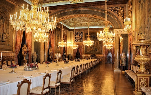 Royal dining room with chandeliers and ornate decor, Royal Palace of Madrid state room.