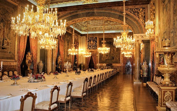 Royal dining room with chandeliers and ornate decor, Royal Palace of Madrid state room.
