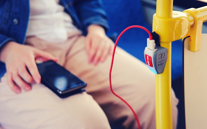 Mobile phone charging on a bus from Fiumicino Airport to Naples.