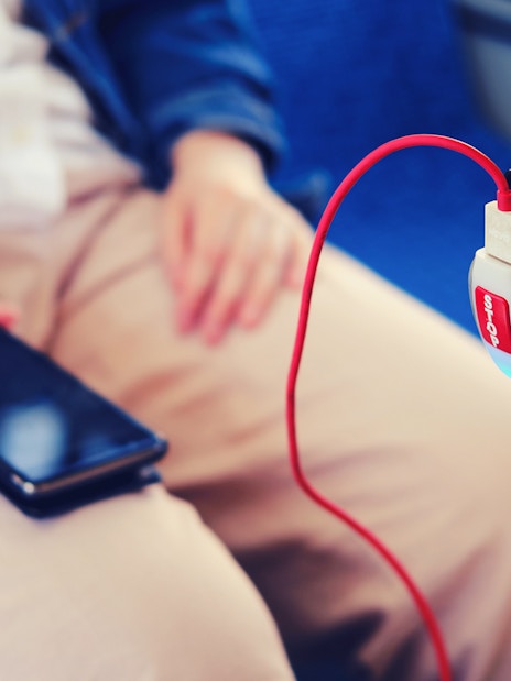 Mobile phone charging on a bus from Fiumicino Airport to Naples.