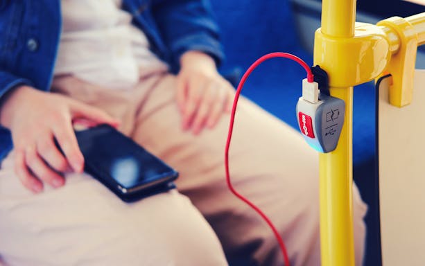 Mobile phone charging on a bus from Fiumicino Airport to Naples.