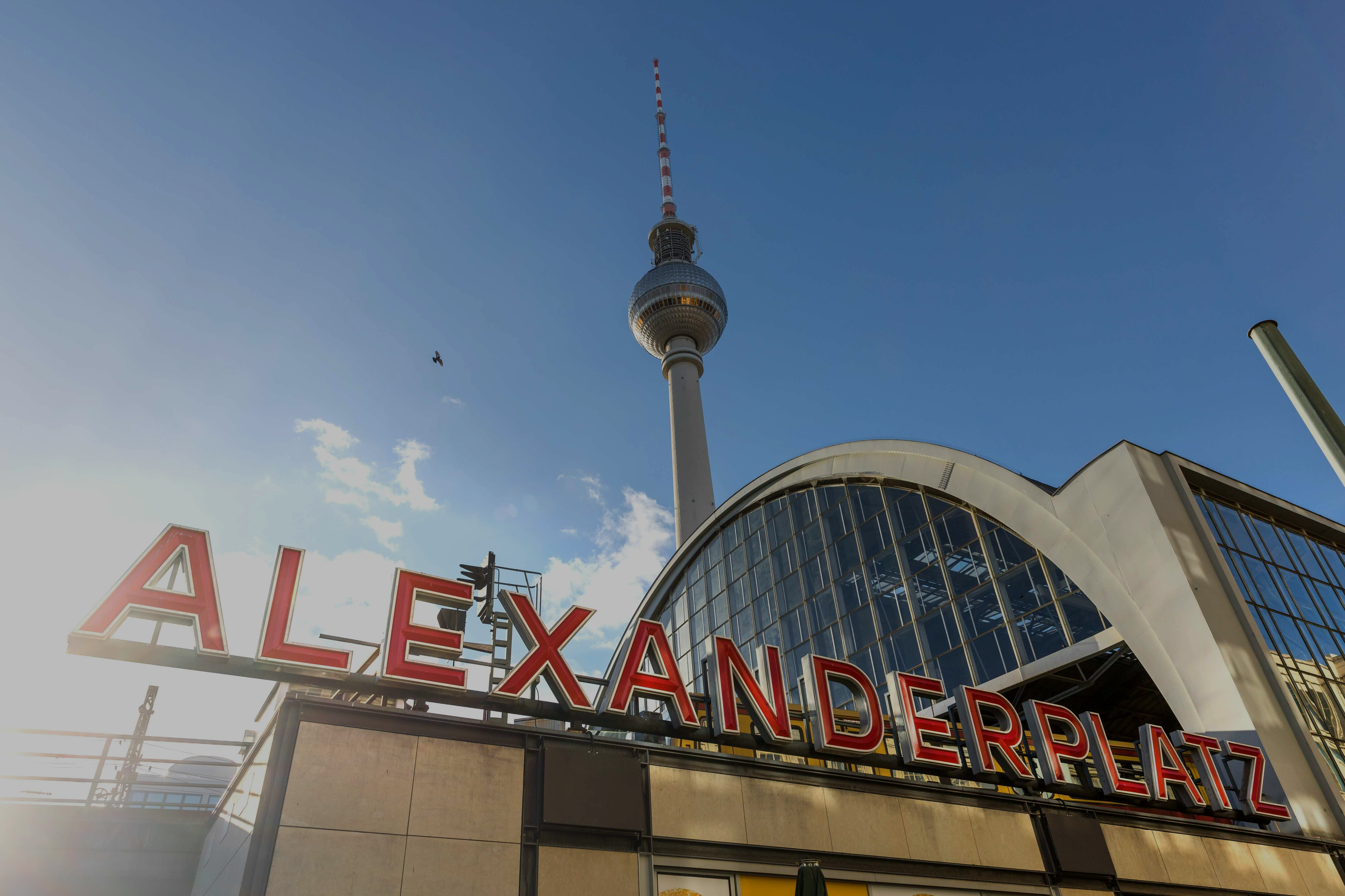 Alexanderplatz sign with TV Tower in Berlin, Germany.
