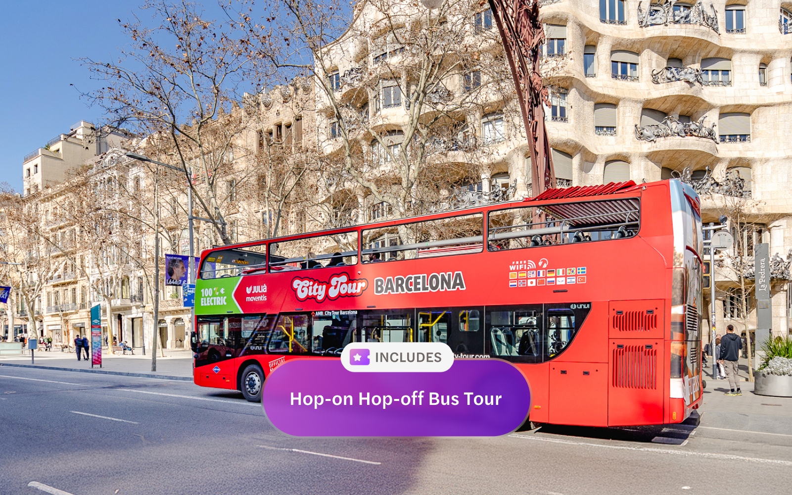 Red double-decker bus on a hop-on hop-off tour in front of Casa Milà, Barcelona.