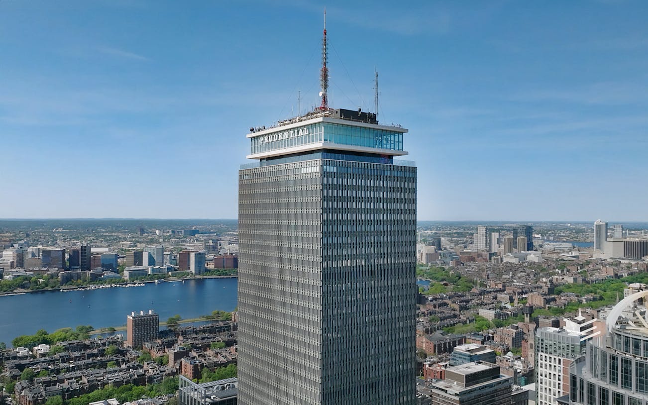 Prudential Tower in Boston with city skyline and Charles River in view.