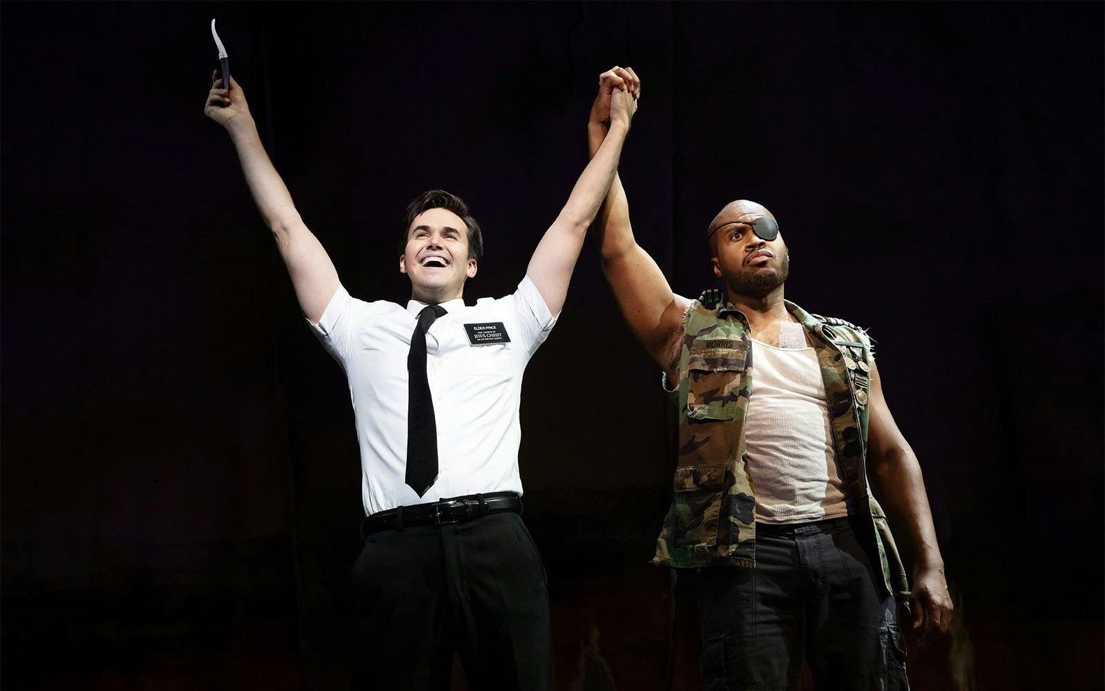 Actors on stage during The Book of Mormon Broadway performance.
