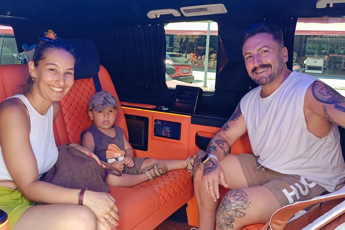 Family enjoying private airport transfer in Antalya vehicle.