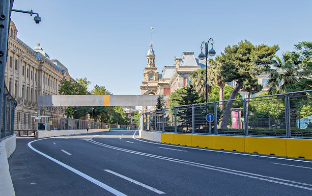 Street circuit for Azerbaijan F1 GP in Baku with historic buildings in the background.
