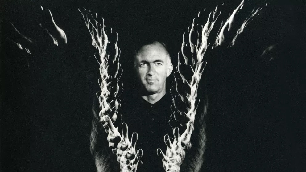 Architect with abstract design, related to Jørn Utzon and Sydney Opera House history.