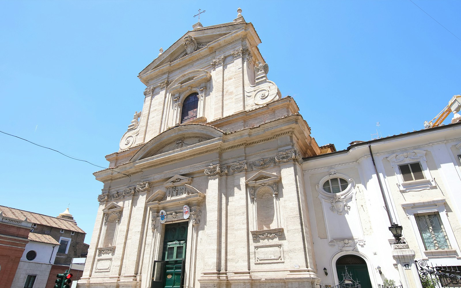 Church of Santa Maria della Vittoria facade in Rome under clear blue sky.