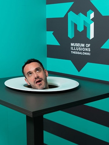 Head illusion exhibit at Museum of Illusions Thessaloniki.