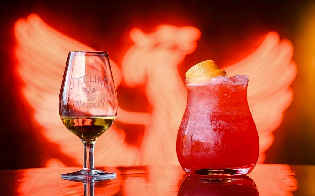 Teeling Whiskey glass and cocktail with orange garnish at Teeling Whiskey Distillery.