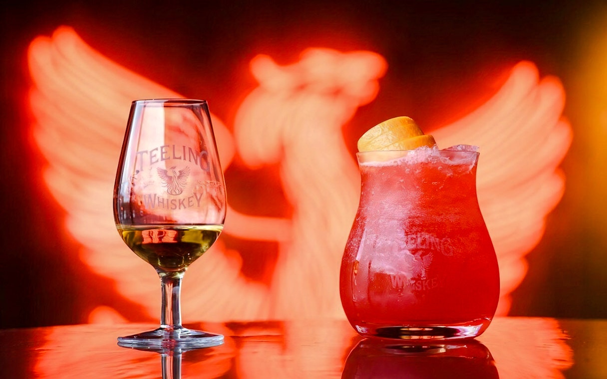 Teeling Whiskey glass and cocktail with orange garnish at Teeling Whiskey Distillery.