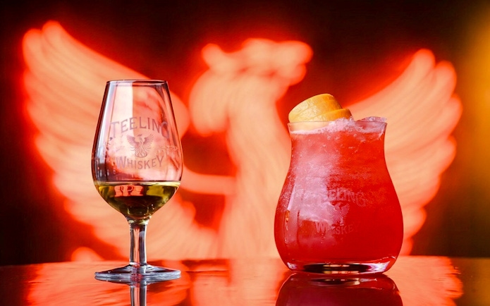 Teeling Whiskey glass and cocktail with orange garnish at Teeling Whiskey Distillery.