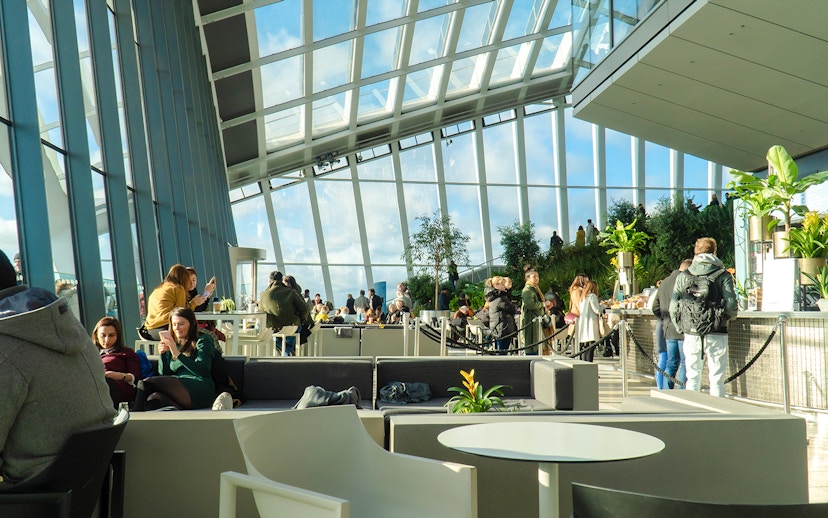 Visitors enjoying the view and greenery at Sky Garden, London.