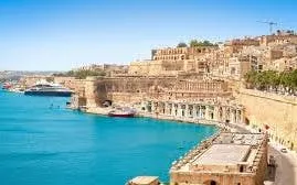 Valletta waterfront with historic buildings and harbor, Malta.