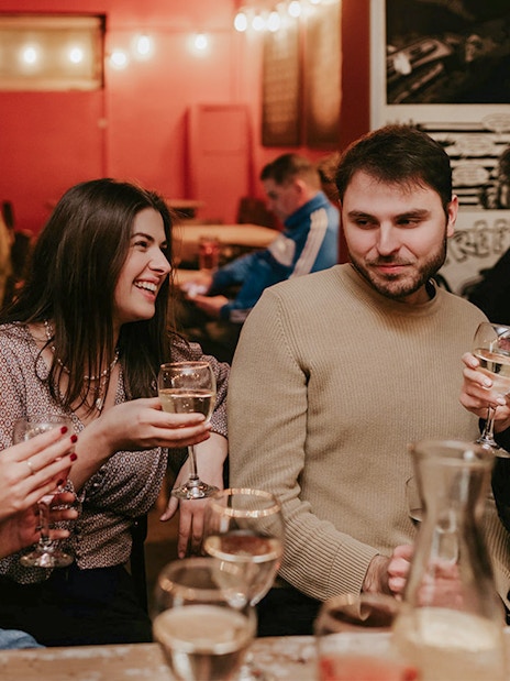 Group enjoying drinks at a bar during Budapest Tipsy Tour.