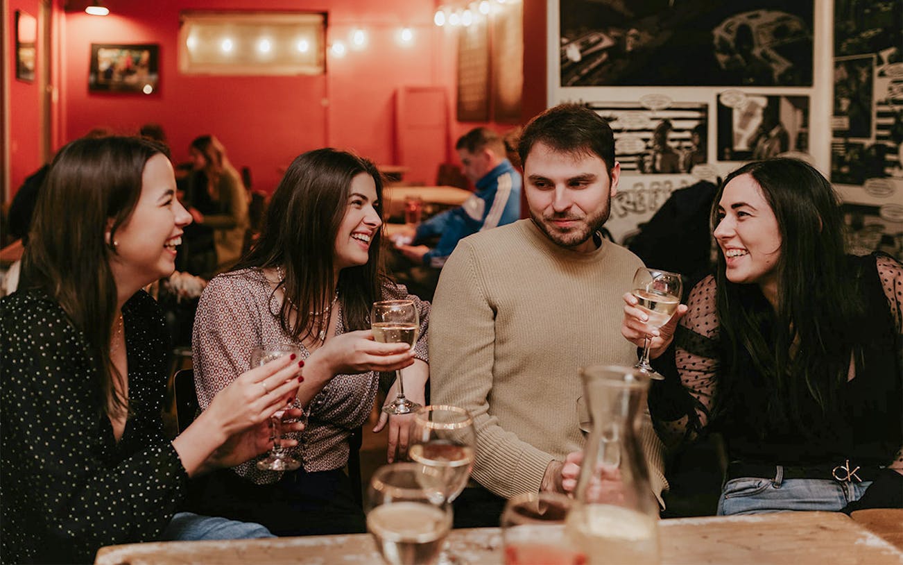 Group enjoying drinks at a bar during Budapest Tipsy Tour.