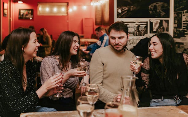 Group enjoying drinks at a bar during Budapest Tipsy Tour.