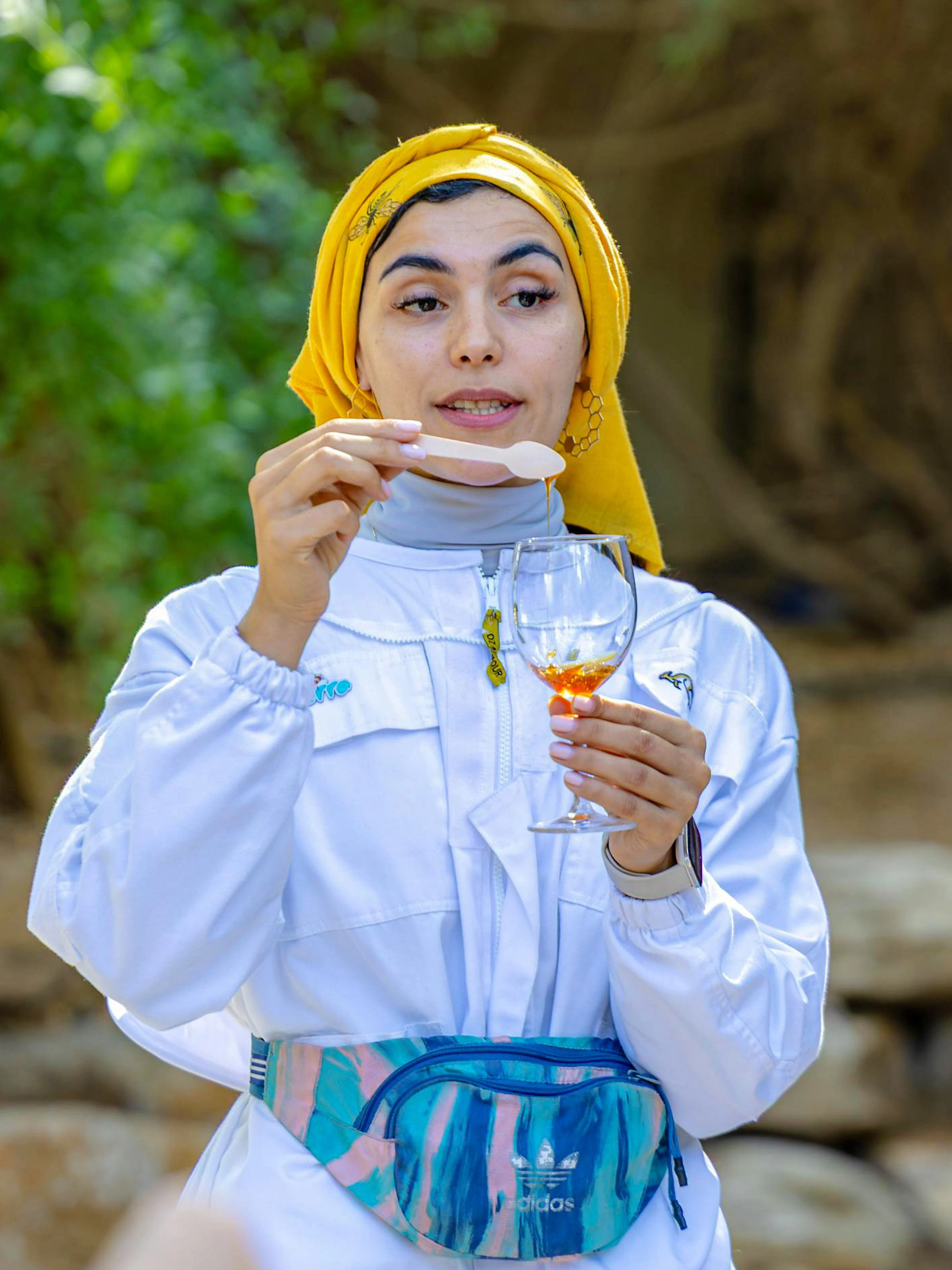 Guide demonstrating honey tasting at A Taste of the Hive, Expo City Dubai.