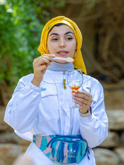 Guide demonstrating honey tasting at A Taste of the Hive, Expo City Dubai.