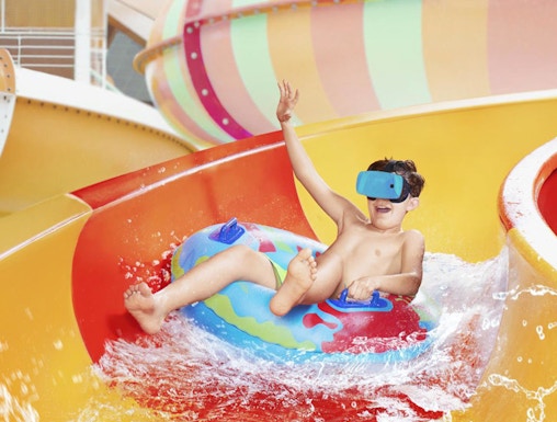 Child enjoying water slide at Aquapalace Prague.