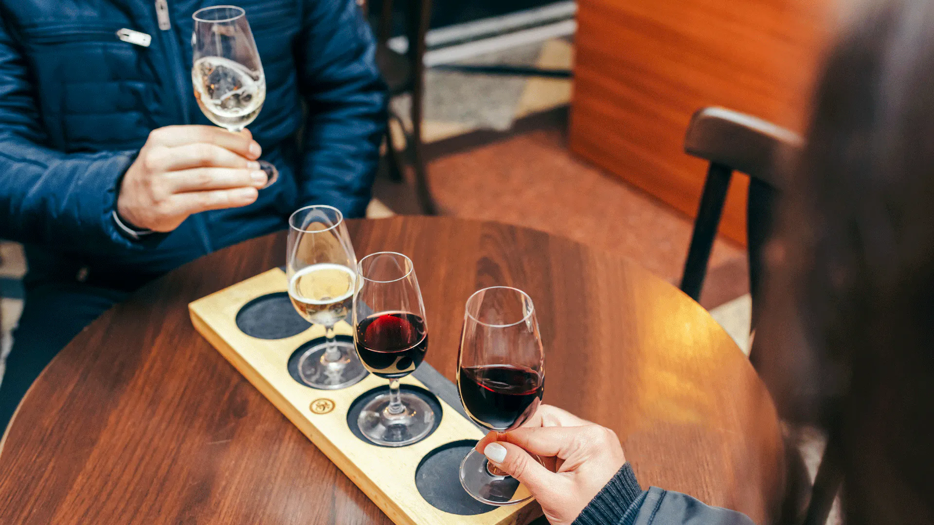 Wine tasting with three glasses on a table in Rio de Janeiro.