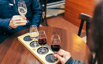 Wine tasting with three glasses on a table in Rio de Janeiro.