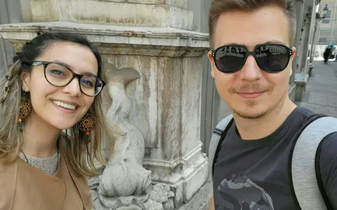Tourists in Munich near historical architecture on a self-guided city exploration game.