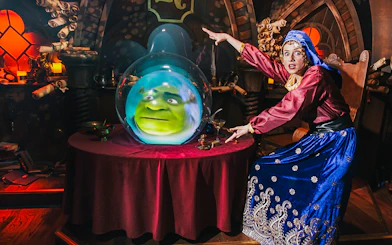 Fortune teller with Shrek's face in a crystal ball at Shrek’s Adventure! London.