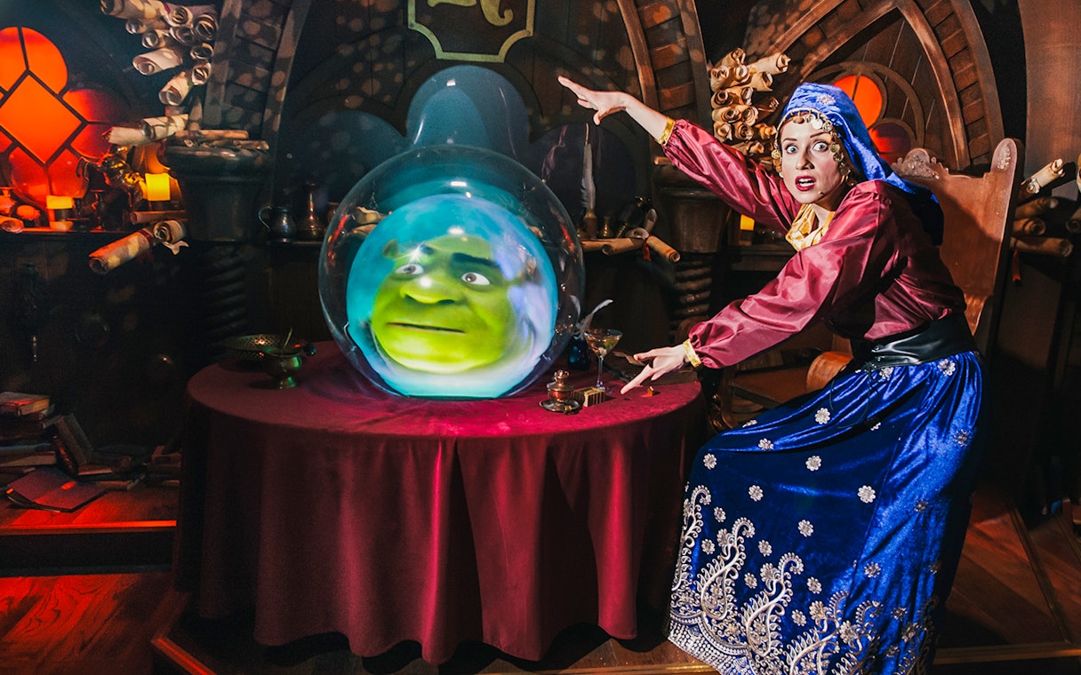 Fortune teller with Shrek's face in a crystal ball at Shrek’s Adventure! London.