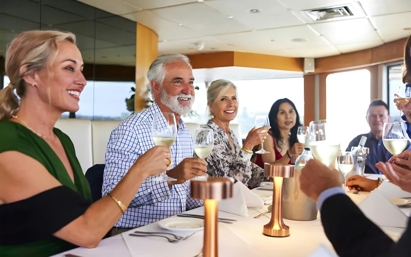 Group enjoying a three-course dining cruise with wine.