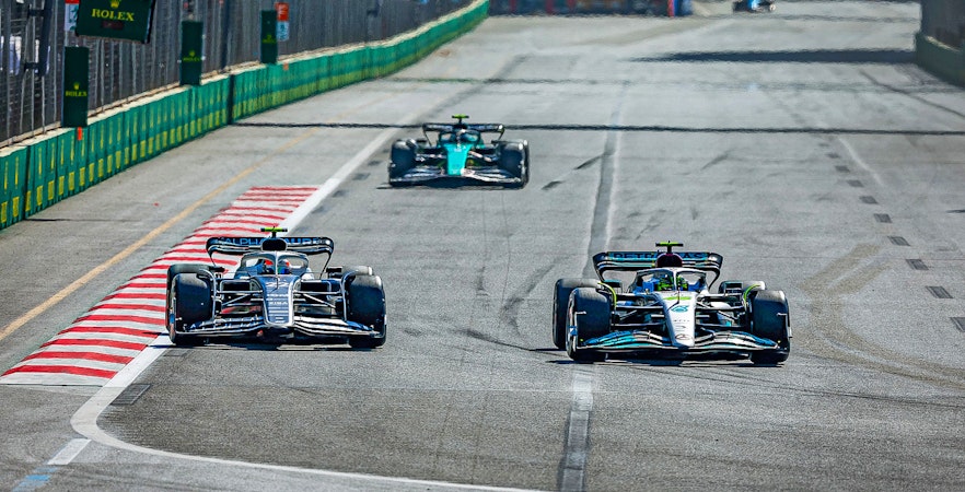 Race cars on track at Formula 1 Azerbaijan Grand Prix in Baku.
