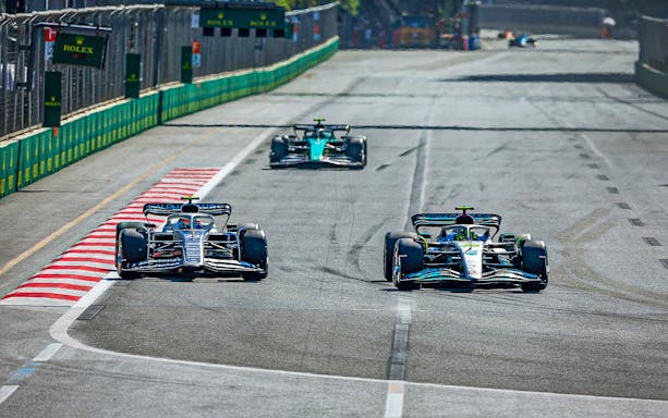 Race cars on track at Formula 1 Azerbaijan Grand Prix in Baku.
