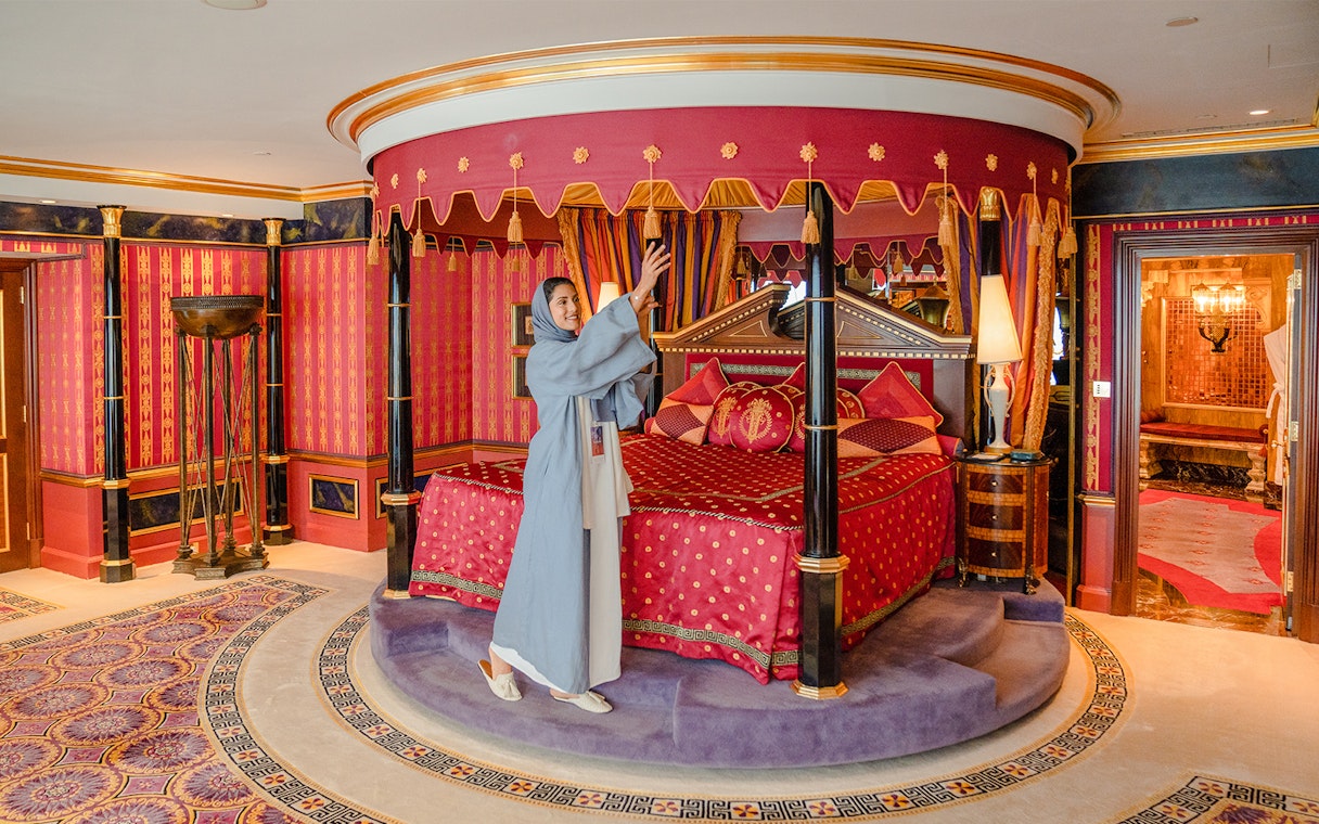 Royal Suite bedroom with ornate canopy bed inside Burj Al Arab, Dubai.