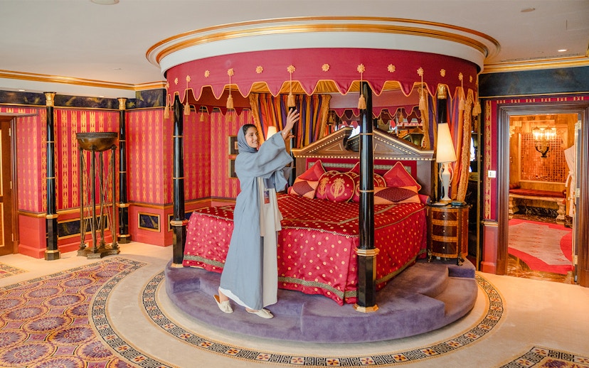 Royal Suite bedroom with ornate canopy bed inside Burj Al Arab, Dubai.