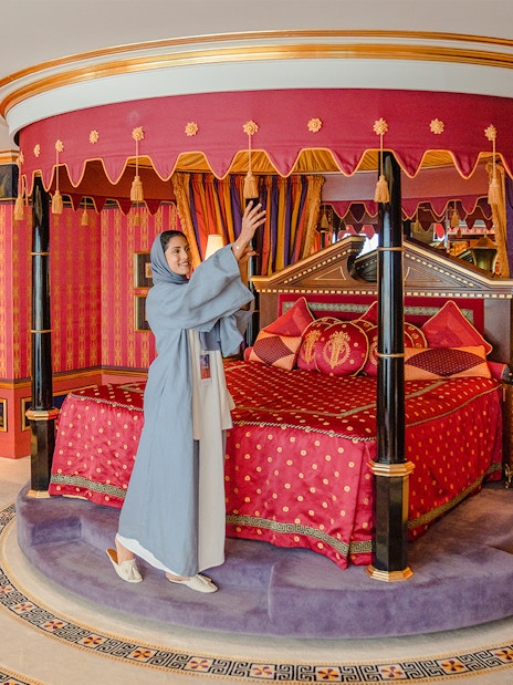 Royal Suite bedroom with ornate canopy bed inside Burj Al Arab, Dubai.