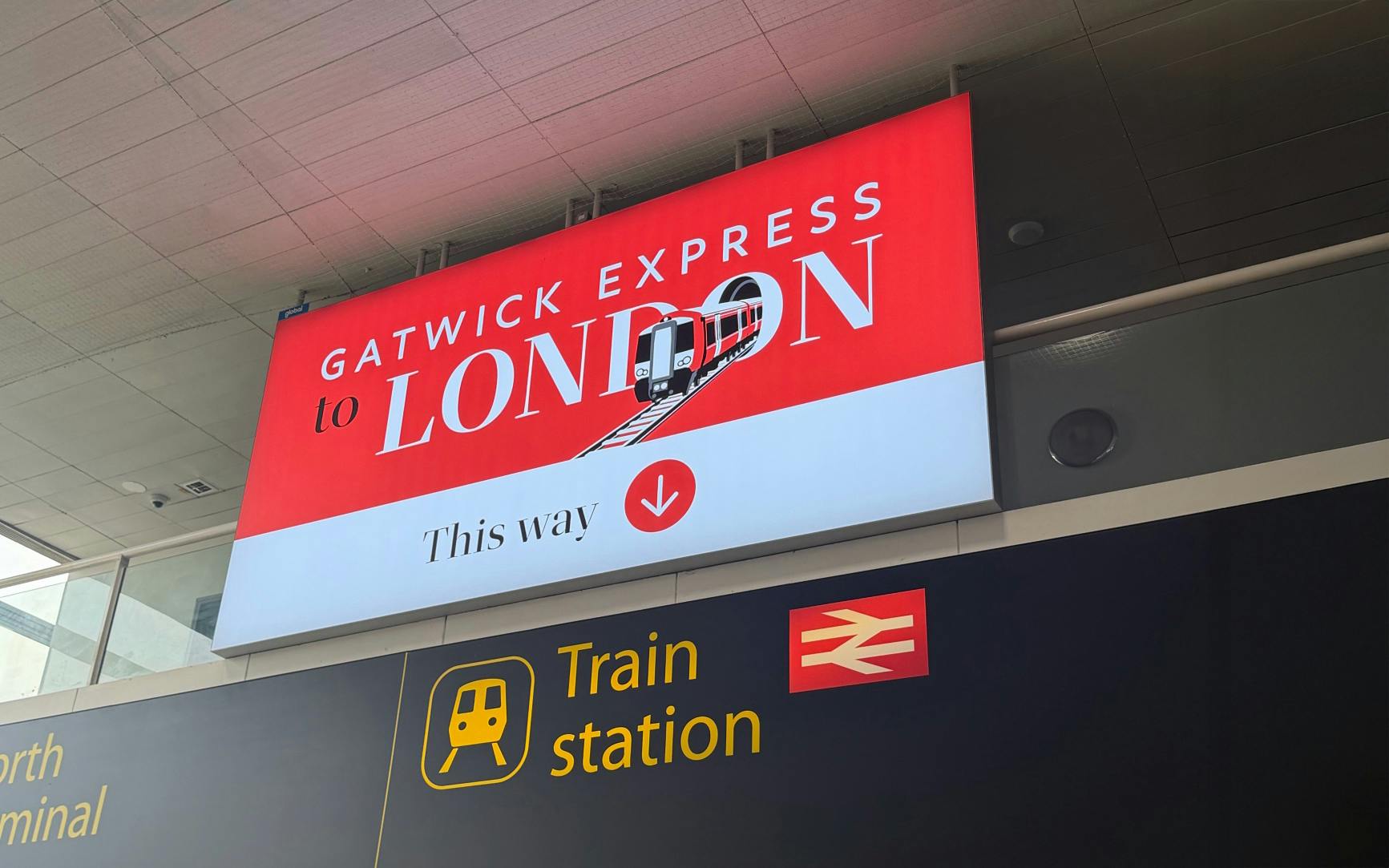 Gatwick Express sign directing to London train at Gatwick Airport station.