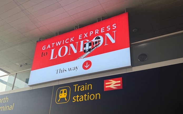 Gatwick Express sign directing to London train at Gatwick Airport station.