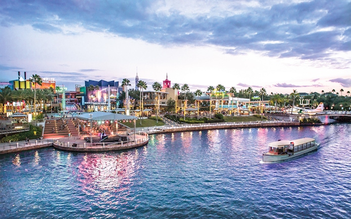 Universal CityWalk Orlando waterfront with boat and vibrant nightlife.