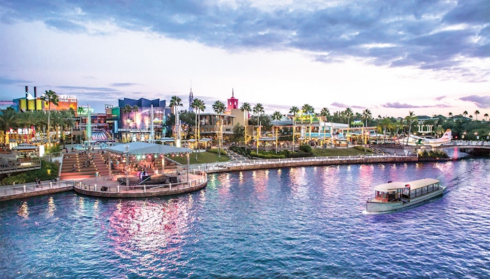 Universal CityWalk Orlando waterfront with boat and vibrant nightlife.