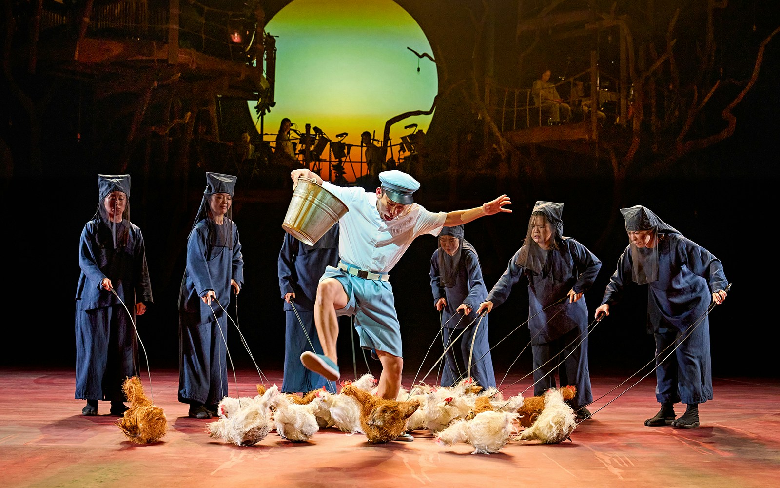 Performance scene from My Neighbour Totoro with actors and puppets on stage.