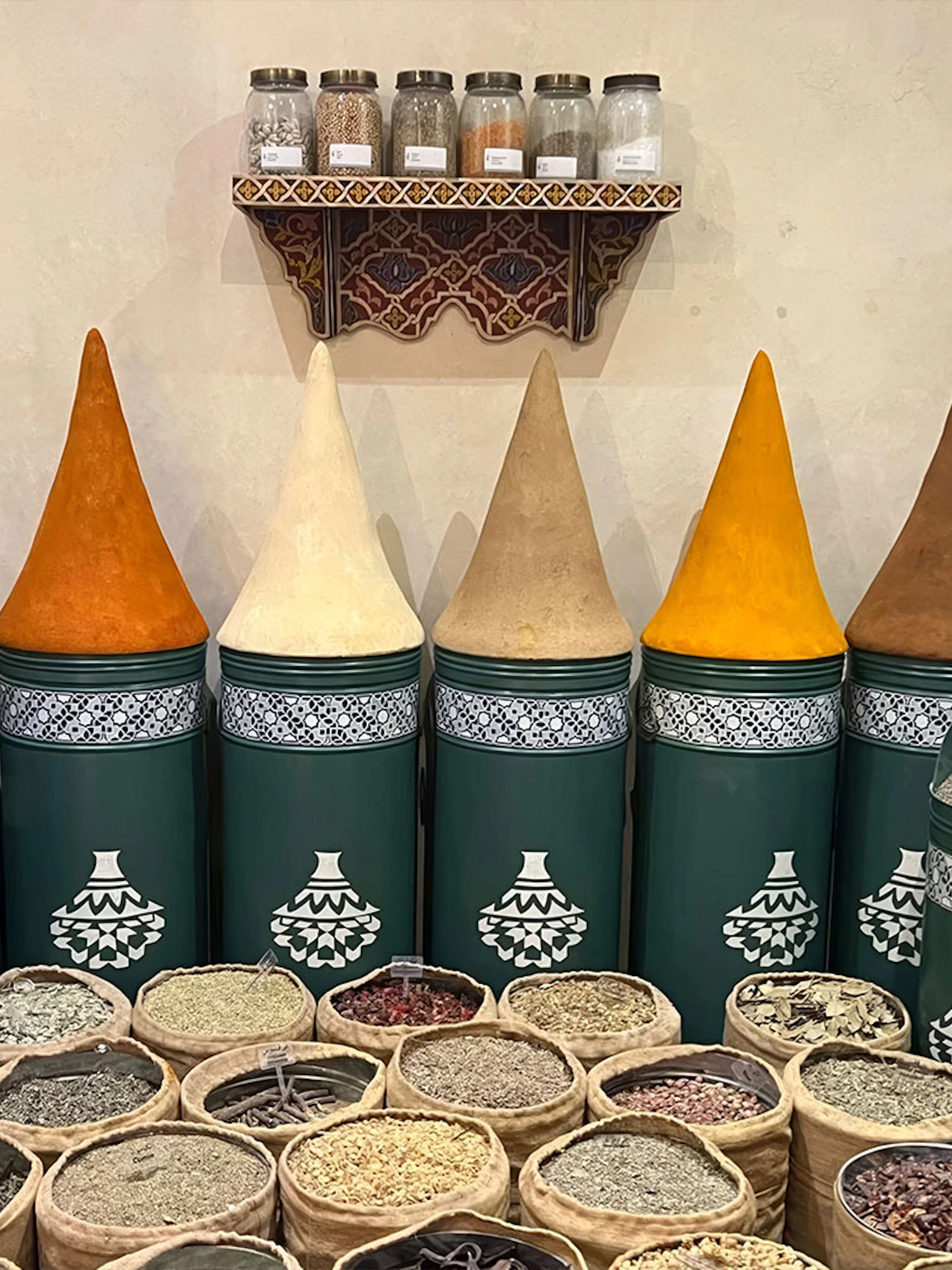 Spices displayed in jars and sacks at Moroccan Culinary Art Museum.