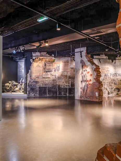 Exhibit of wartime artifacts and murals at Mémorial de Caen, Normandy, France.